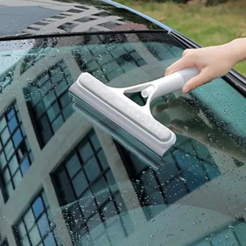 Window cleaning squeegee with detergent sprayer
