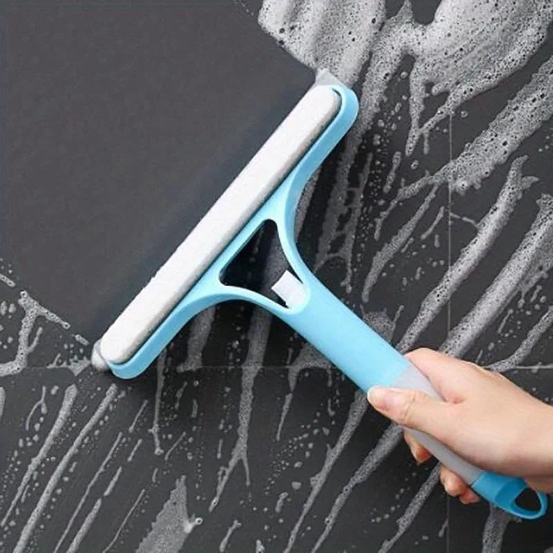 Window cleaning squeegee with detergent sprayer